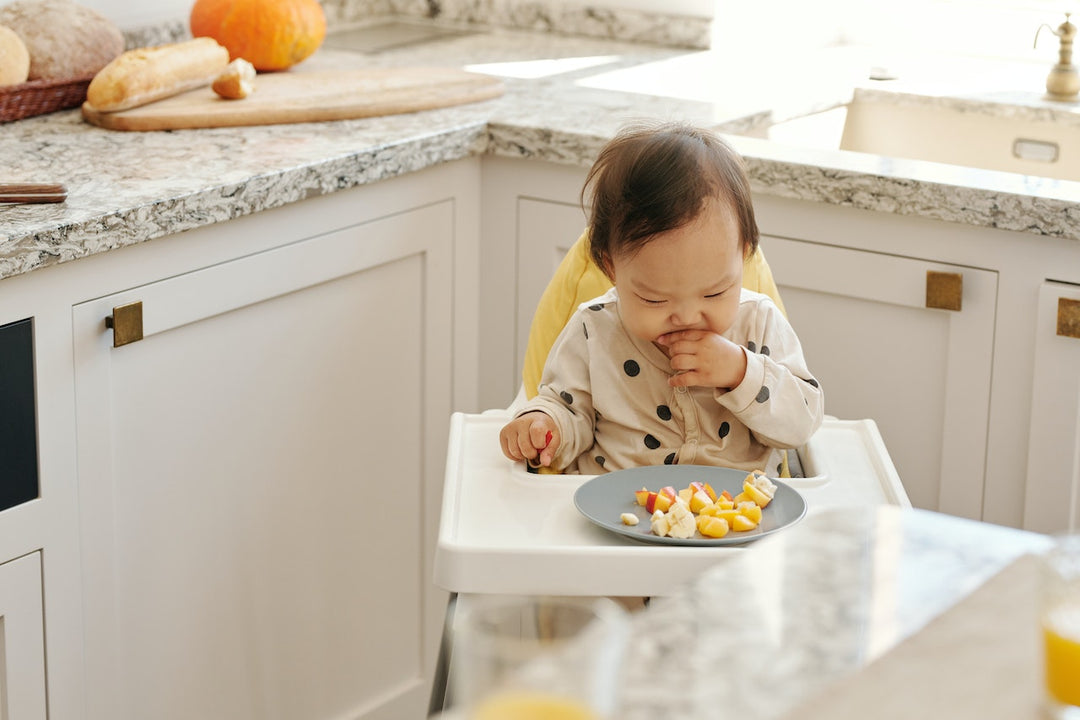 child sitting on high chair