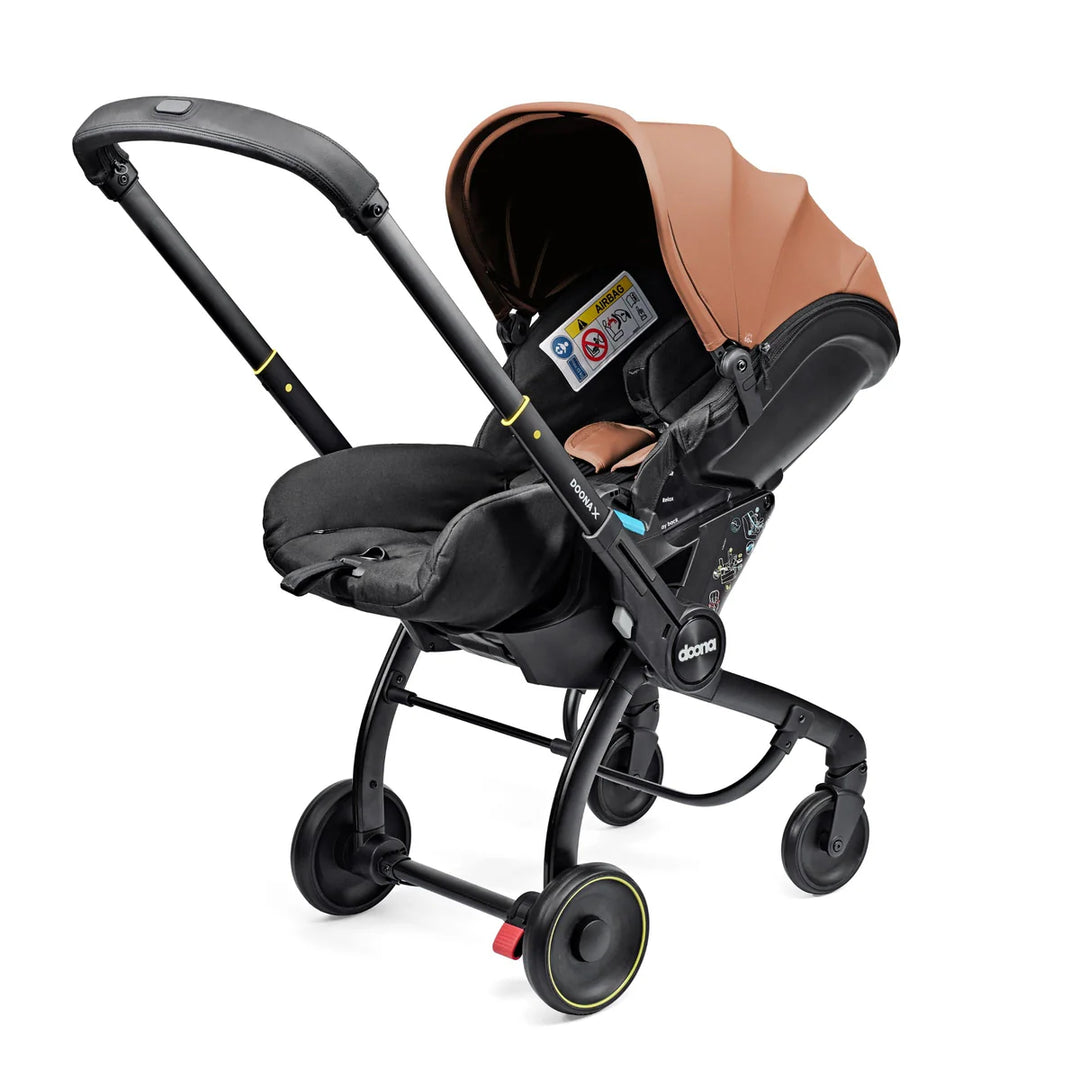 Doona X Car Seat & Stroller - Terracotta + FREE Essentials Bag