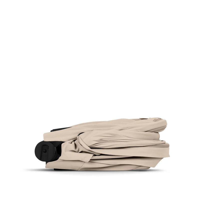 Cybex COŸA Comfort + Foldable Carrycot Matt Black - Cozy Beige (2026 Model)