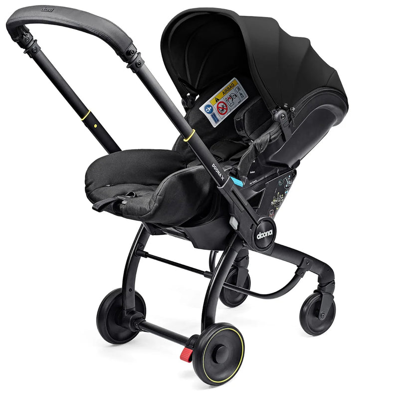 Doona X Recline Car Seat & Stroller with Isofix Base & Rain Cover Bundle - Nitro Black + FREE Essentials Bag Worth £54.99!