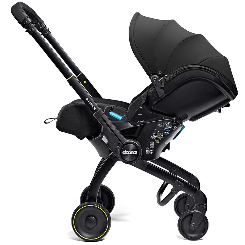 Doona X Recline Car Seat & Stroller with Isofix Base & Rain Cover Bundle - Nitro Black + FREE Essentials Bag Worth £54.99!