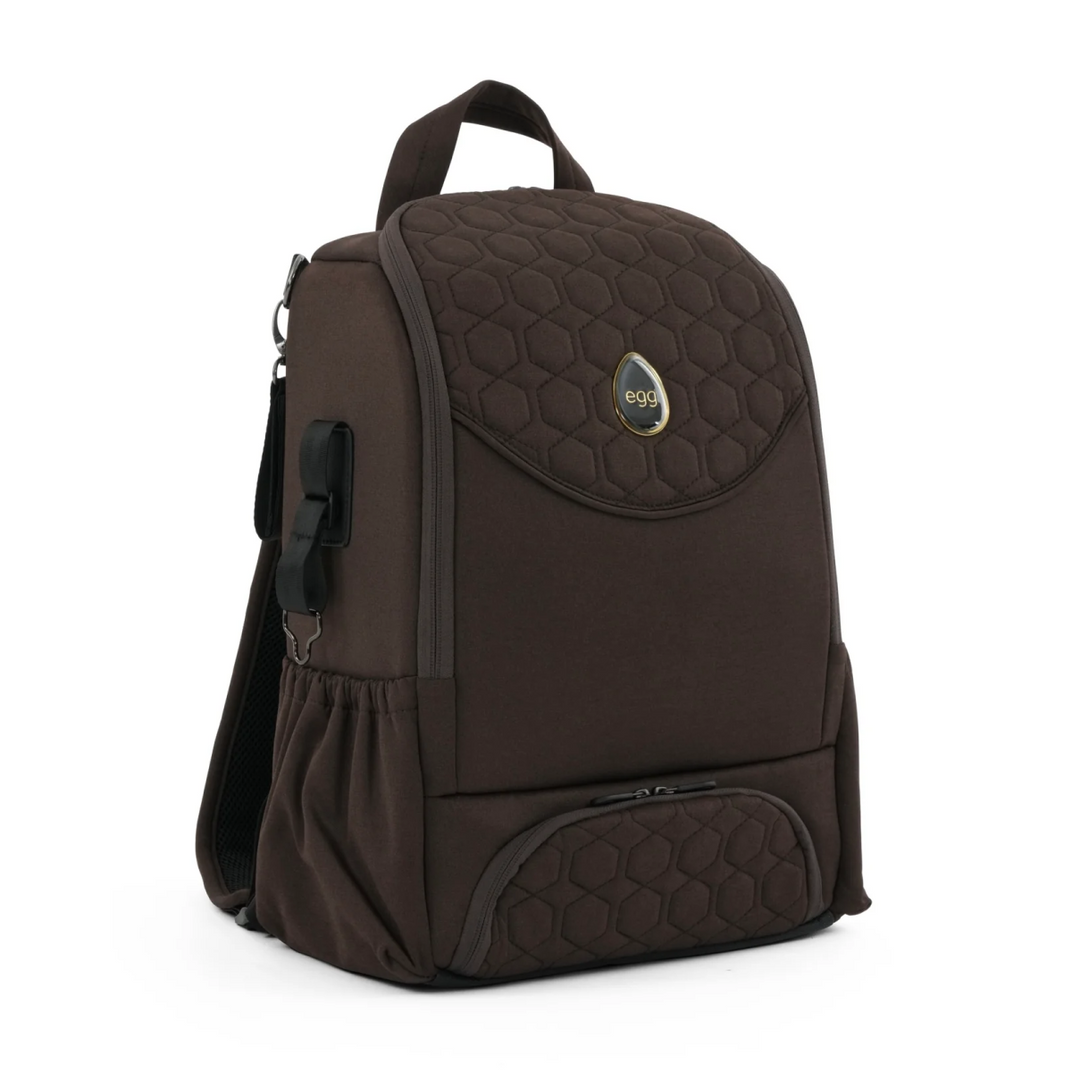 Brown backpack with quilted design on a white background